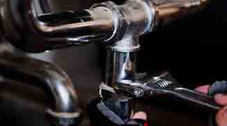Handyman repairing plumbing